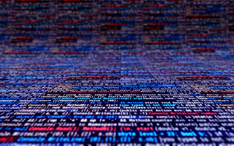 Colorful computer code receding into the background.