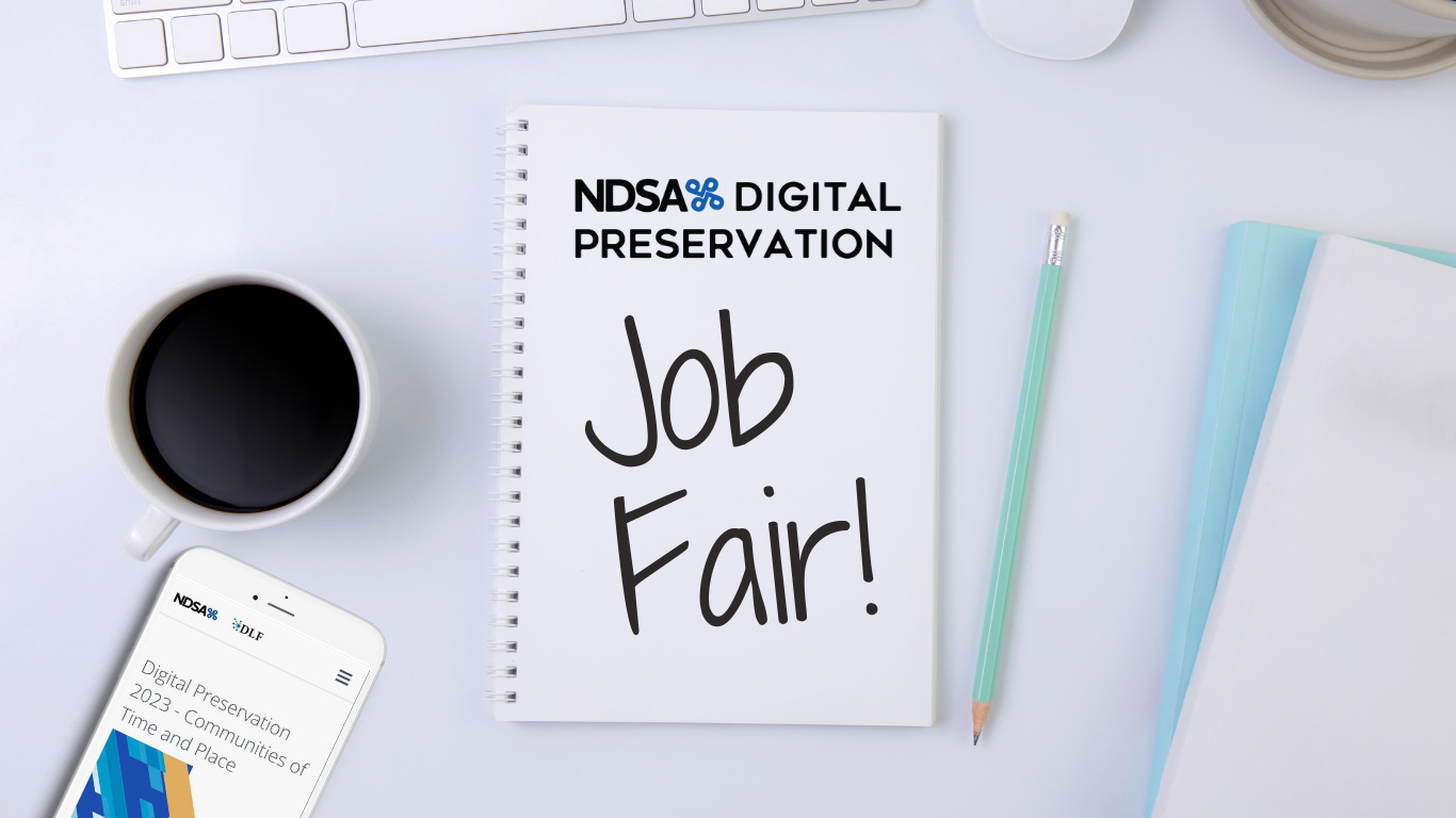 Color photo of top down view of white desk with white keyboard, full coffee mug, cell phone, and note pad. On note pad: NDSA DigiPres logo and handwritten words "Job Fair!"