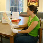 A student works with materials at the Avery Research Center for African American History and Culture